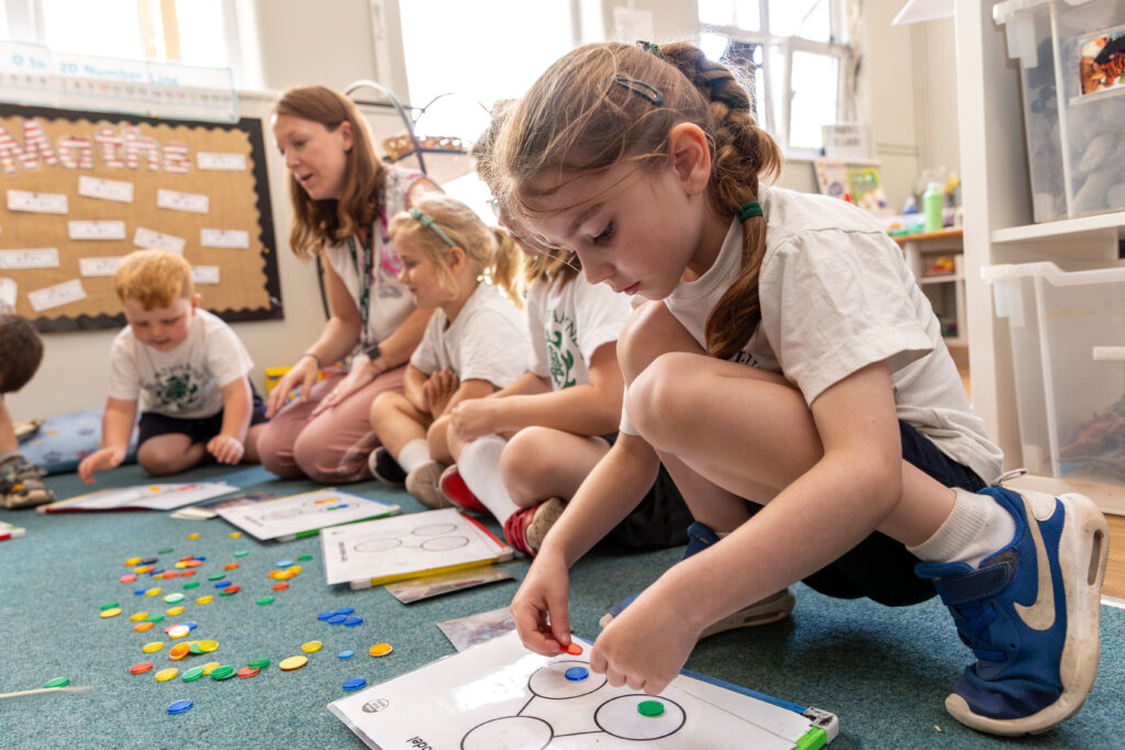 young children in a practical maths lesson
